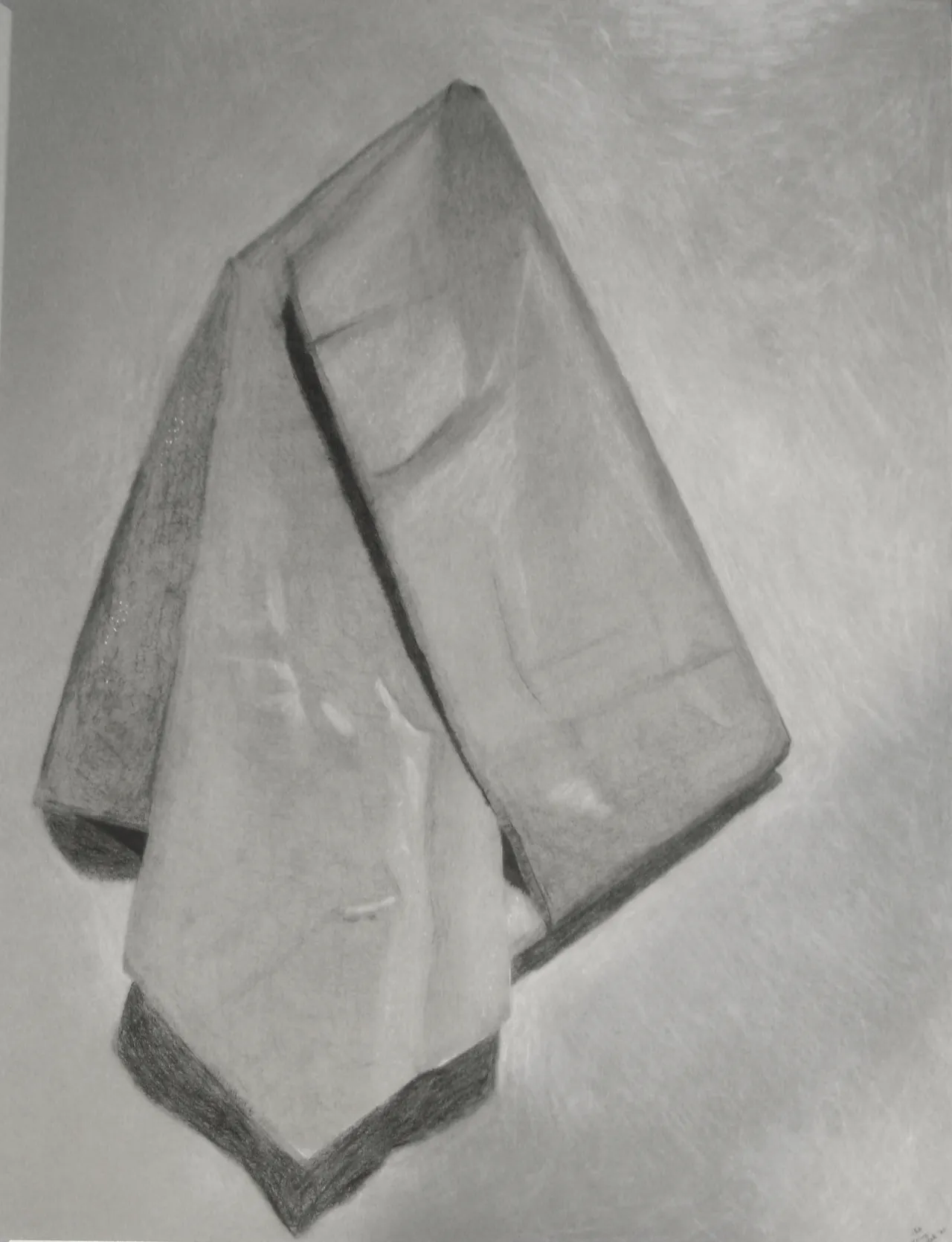 A piece of cloth pinned up against a wall, rendered in charcoal