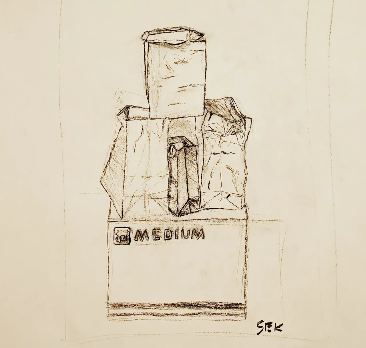 Five paper bags sitting atop a box that reads "MEDIUM". Three form the base with their short sides facing to the front, the left bag is a plain paper grocery bag, the center bag has some wavy patterns and a little ribbon sticking out, the bag on the right is significantly crumpled, wrinkled, and slightly torn. Stacked on top of those three is the fourth bag, wider face to the front, and on top of it is a long, skinny bag lying horizontally with the top pointing to the left, where the bottom of the bag cinches to a folded edge instead of a square like the grocery bags and gift bag.